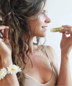 organic lip balm woman holding lemon