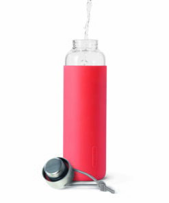 glass water bottle coral pink water pouring