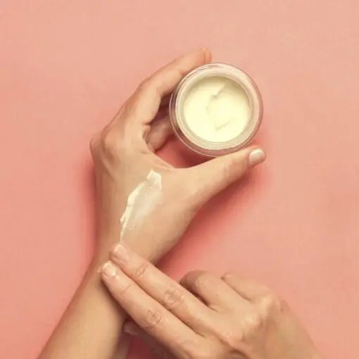natural deodorant co cream on hand